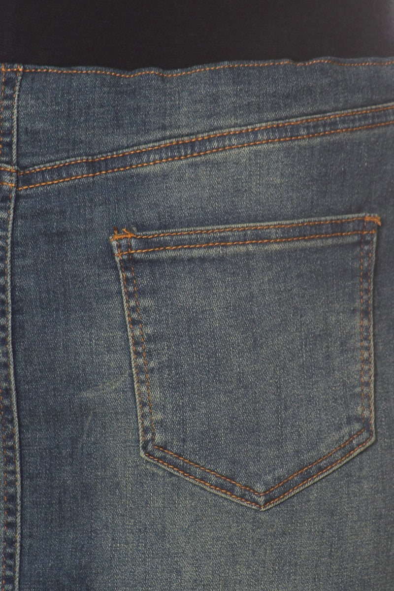 model wears blue wash denim skirt