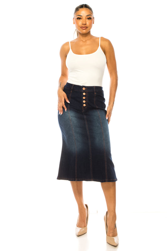 Woman wearing a white tank top and blue denim skirt on a white background