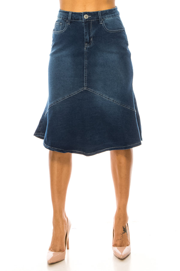 Denim skirt worn by a person on a white background